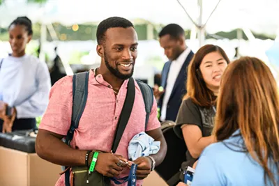photo of students checking in with Housing.